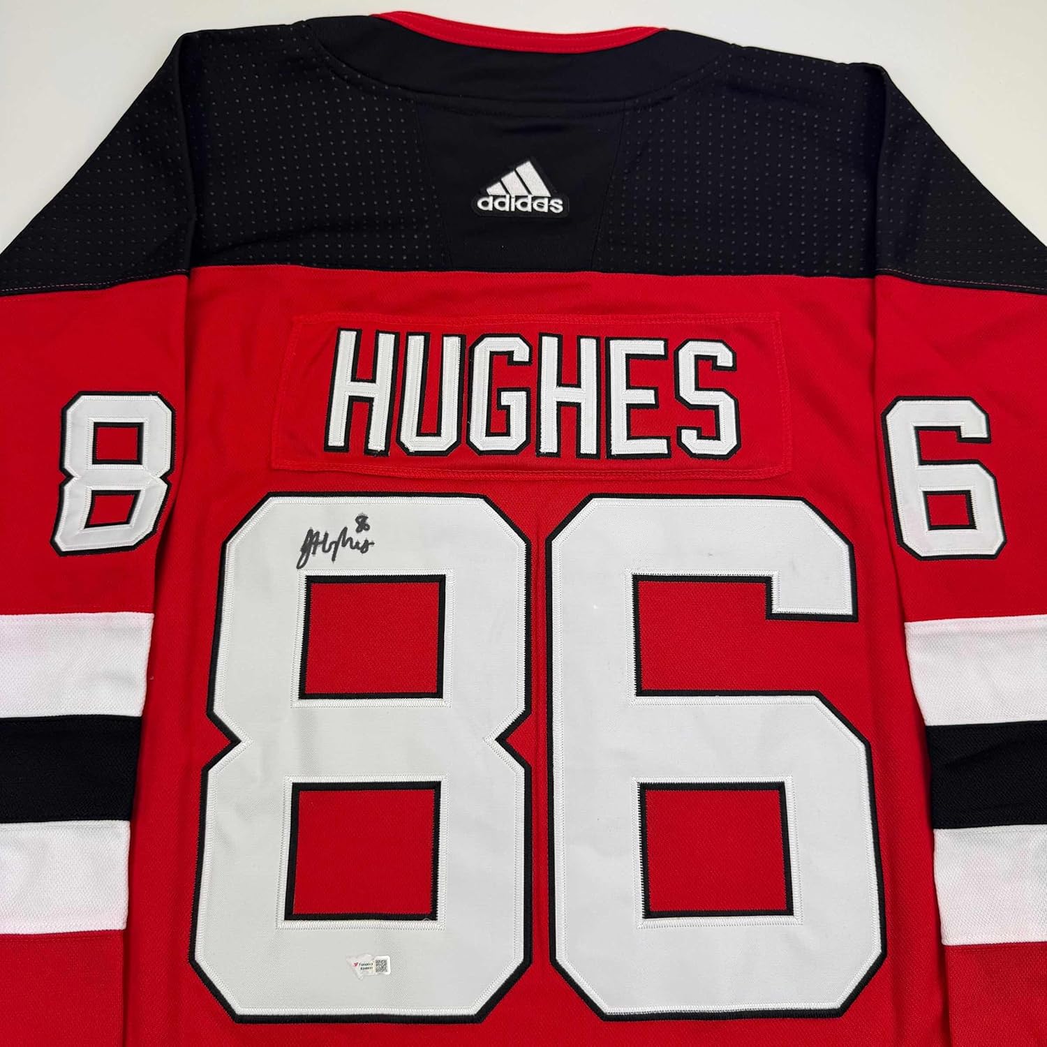 Framed Autographed Jack Hughes 35x39 New Jersey Devils Authentic Red Hockey Jersey