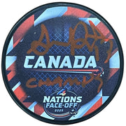 Autographed Team Canada Sam Reinhart 4 Nations Hockey Puck with "Champs"