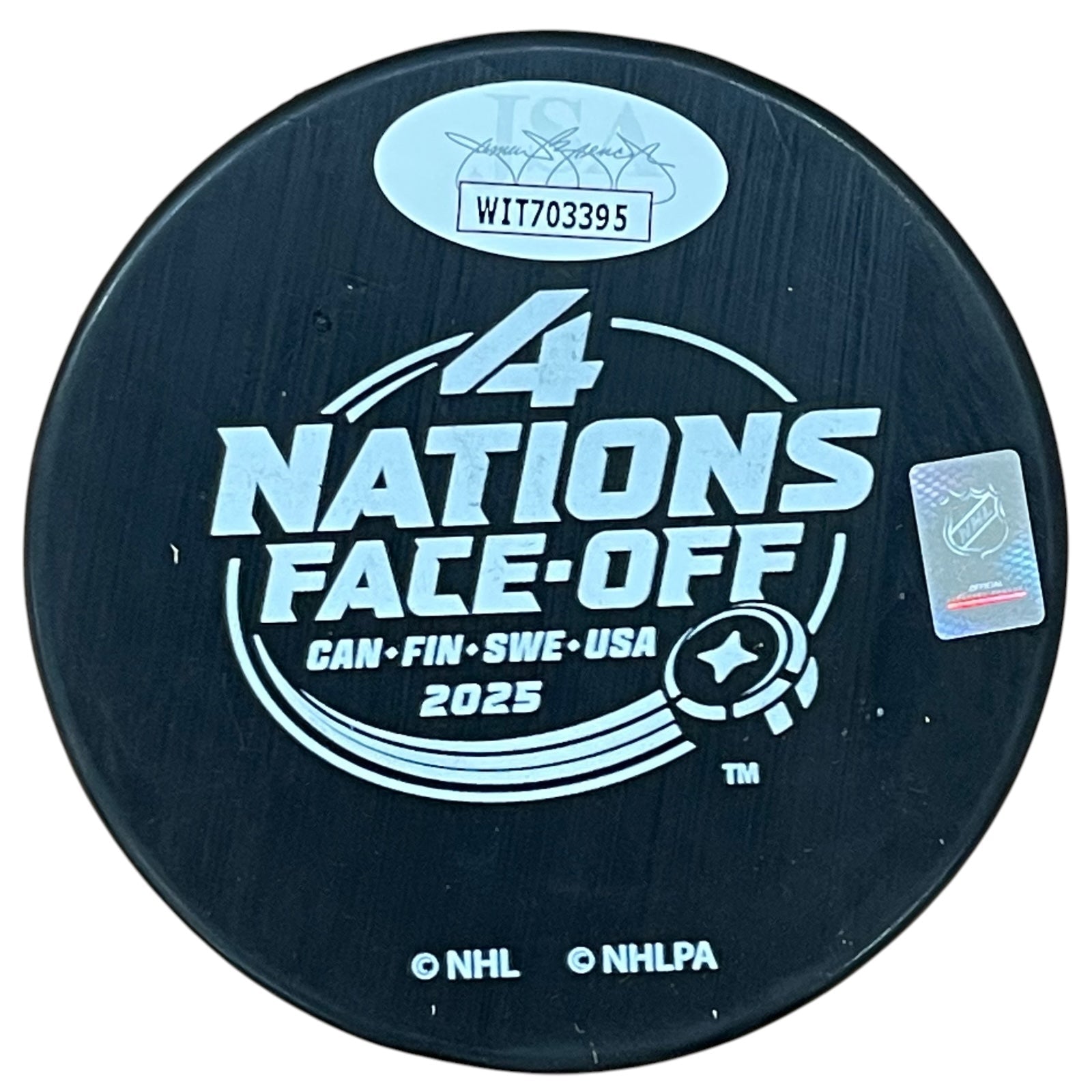 Autographed Team Canada Sam Reinhart 4 Nations Hockey Puck with "Champs"